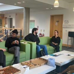 Students from the Consortium of the Global South project, discussing the project at a Consortium Lunch.
